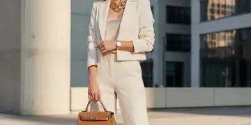 Stylish woman showcasing smart accessorizing techniques with a statement necklace and elegant watch.