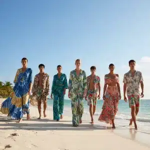 Models on beach wearing vibrant sustainable summer 2026 outfits